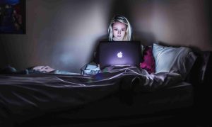 Girl up late on a macbook