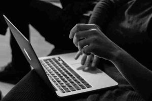 Man using a macbook track pad
