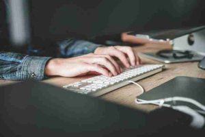Someone typing on a keyboard