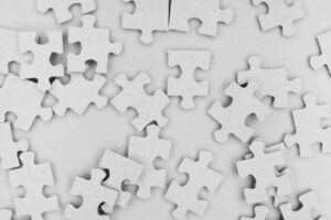 Puzzle pieces on a light grey background